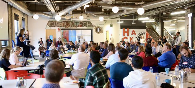 Janet Bannister, Managing Partner at Staircase Ventures, and Caitlin MacGregor, CEO and co-founder of Plum talk to attendees at the Communitech Breakfast Series.