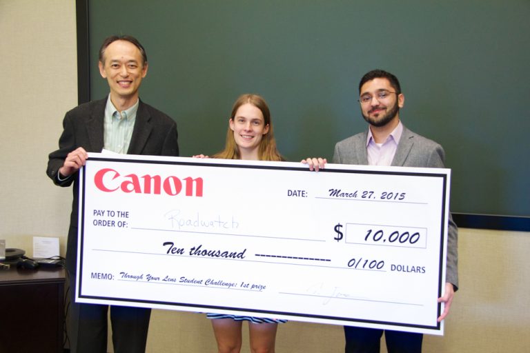 (Left to right) Ted Egawa, Canon Canada President; Catherine Holloway and Osama Sidat of RoadWatch. (Communitech photo: Anthony Reinhart)