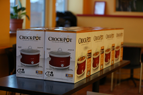 Various boxed Crockpots on a table