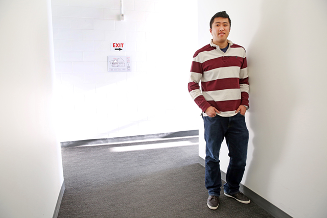 Derek Ting standing in a hallway