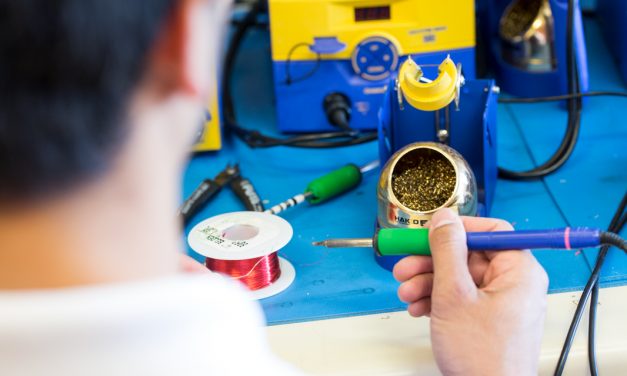 Technician at a lab station with tools