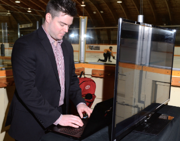 HockeyTech's Ian Mosher on a laptop