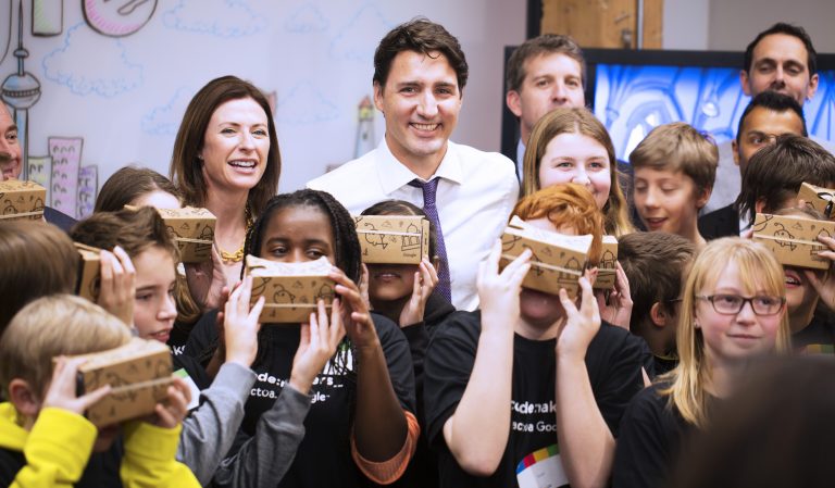 Justin Trudeau poses with cohort of students with Google Cardboards